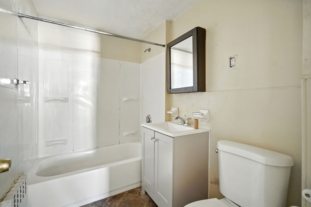 56-58 Phoenix Street Springfield, MA 01104 - Photo 12 of 29 a bathroom with a sink a toilet and shower