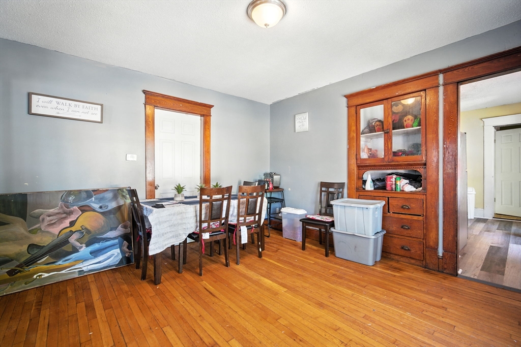 56-58 Phoenix Street Springfield, MA 01104 - Photo 17 of 29 a living room with furniture and wooden floor