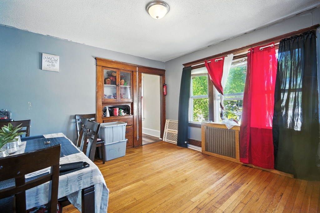 56-58 Phoenix Street Springfield, MA 01104 - Photo 18 of 29 a workspace with furniture window and wooden floor