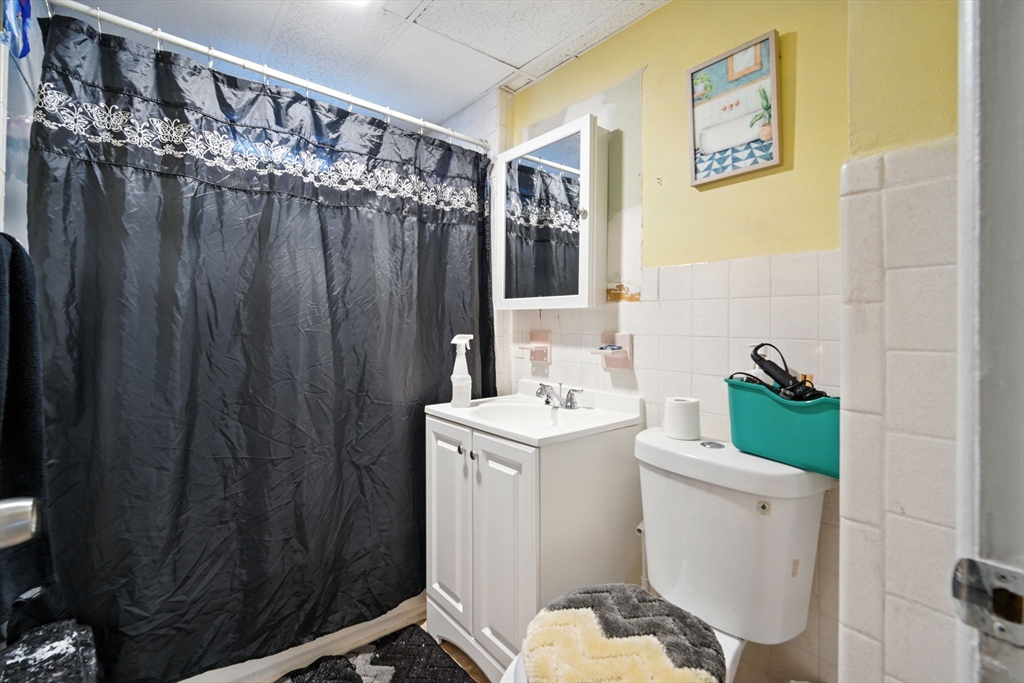 56-58 Phoenix Street Springfield, MA 01104 - Photo 22 of 29 a bathroom with a sink a toilet and shower