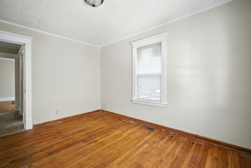 56-58 Phoenix Street Springfield, MA 01104 - Photo 10 of 29 a view of empty room with wooden floor