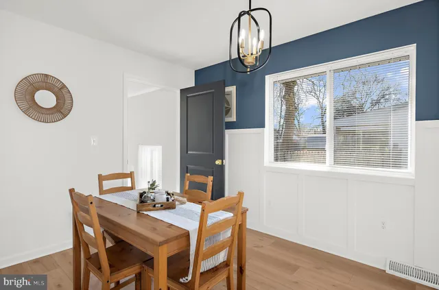 a bedroom with a bed and a wall painting