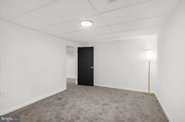 a bathroom with a shower and a glass door