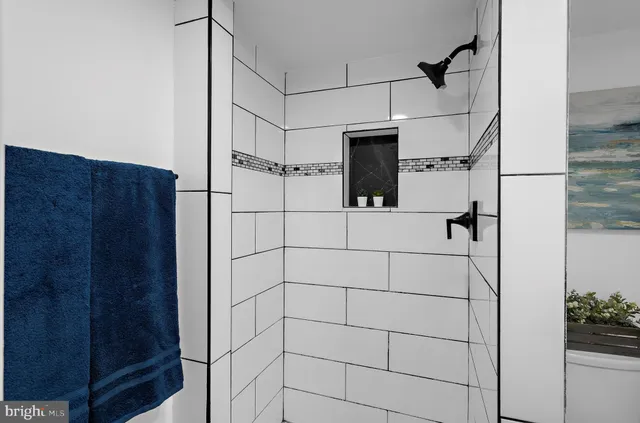 a view of small yard and large tree