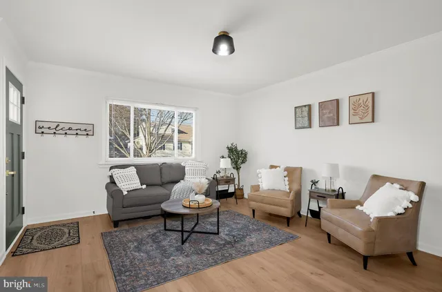 a living room with furniture and a rug
