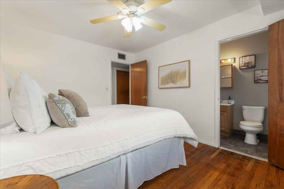 386 Heath Street Milpitas, CA 95035 - Photo 17 of 22 a bedroom with a bed and a chandelier