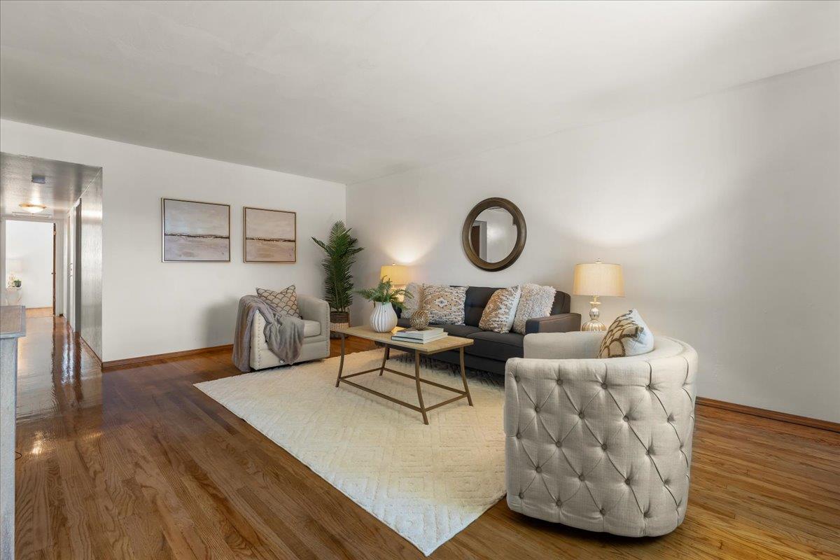 386 Heath Street Milpitas, CA 95035 - Photo 5 of 22 a living room with couches chairs and wooden floor