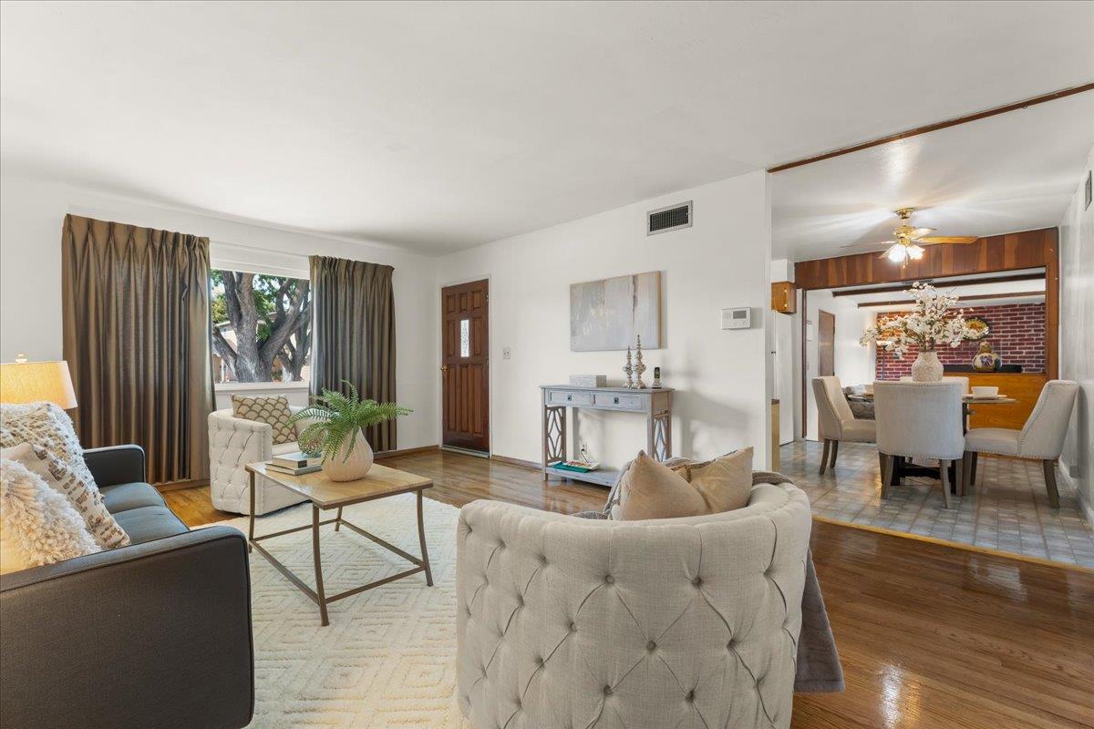 386 Heath Street Milpitas, CA 95035 - Photo 7 of 22 a living room with furniture and a large window