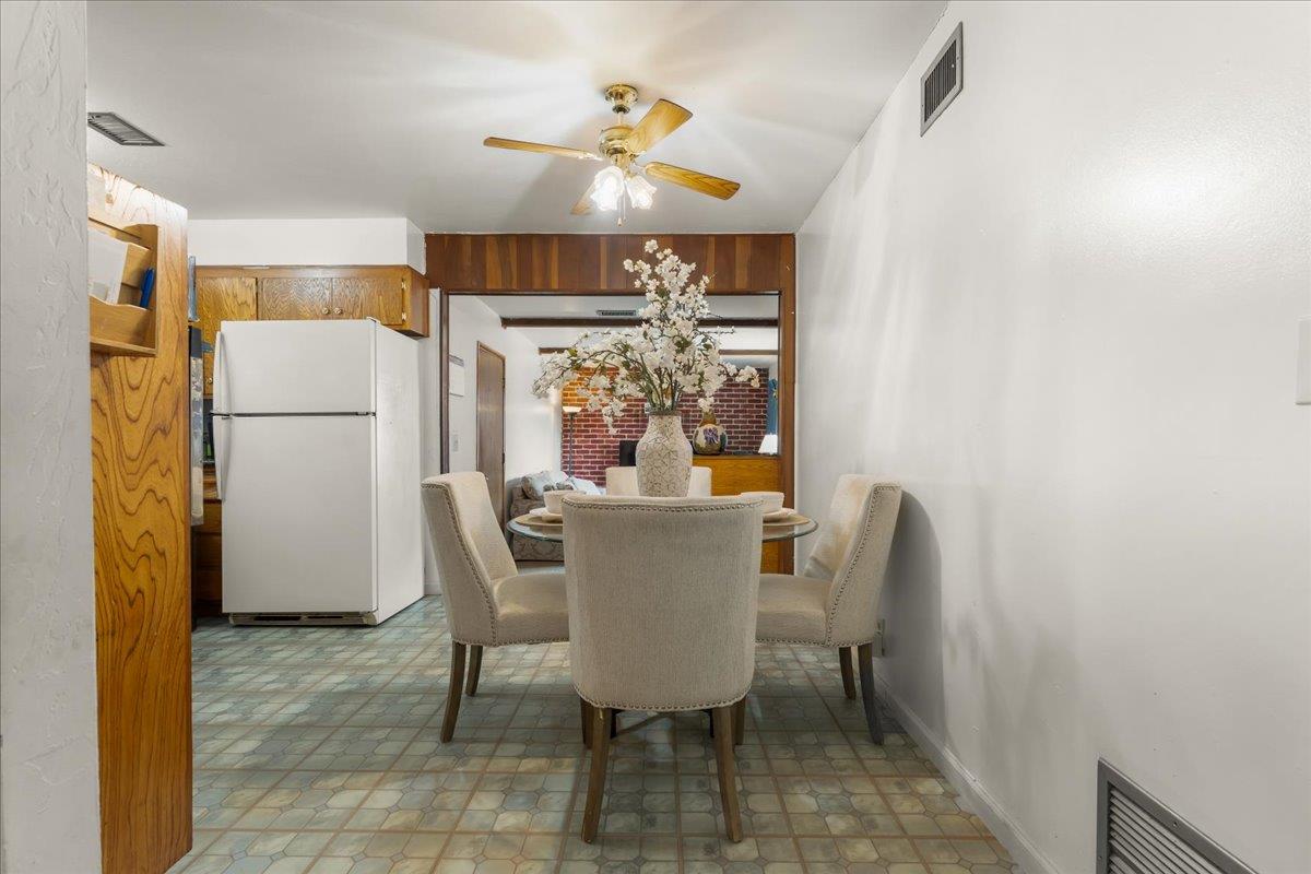 386 Heath Street Milpitas, CA 95035 - Photo 8 of 22 a view of a dining room with furniture and a chandelier fan