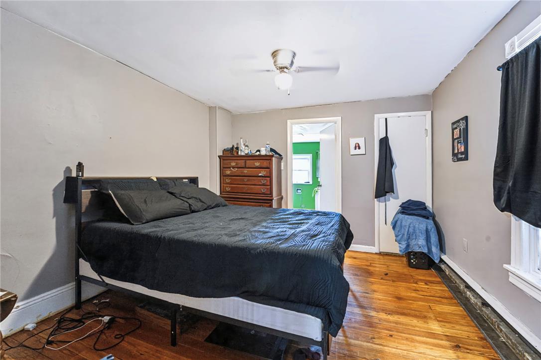 1030 Monocacy Street Bethlehem, PA 18018 - Photo 14 of 34 Warm wood floors ground this bedroom, highlighting its functional layout and cozy architecture.