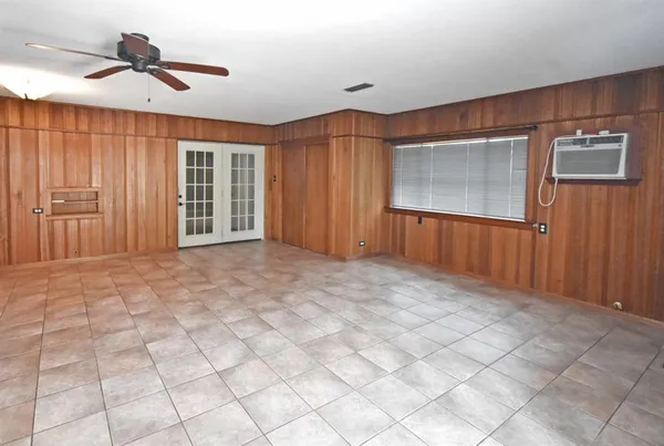 a kitchen with stainless steel appliances granite countertop a stove a sink and white cabinets