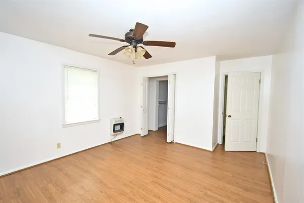 a kitchen with a refrigerator and cabinets
