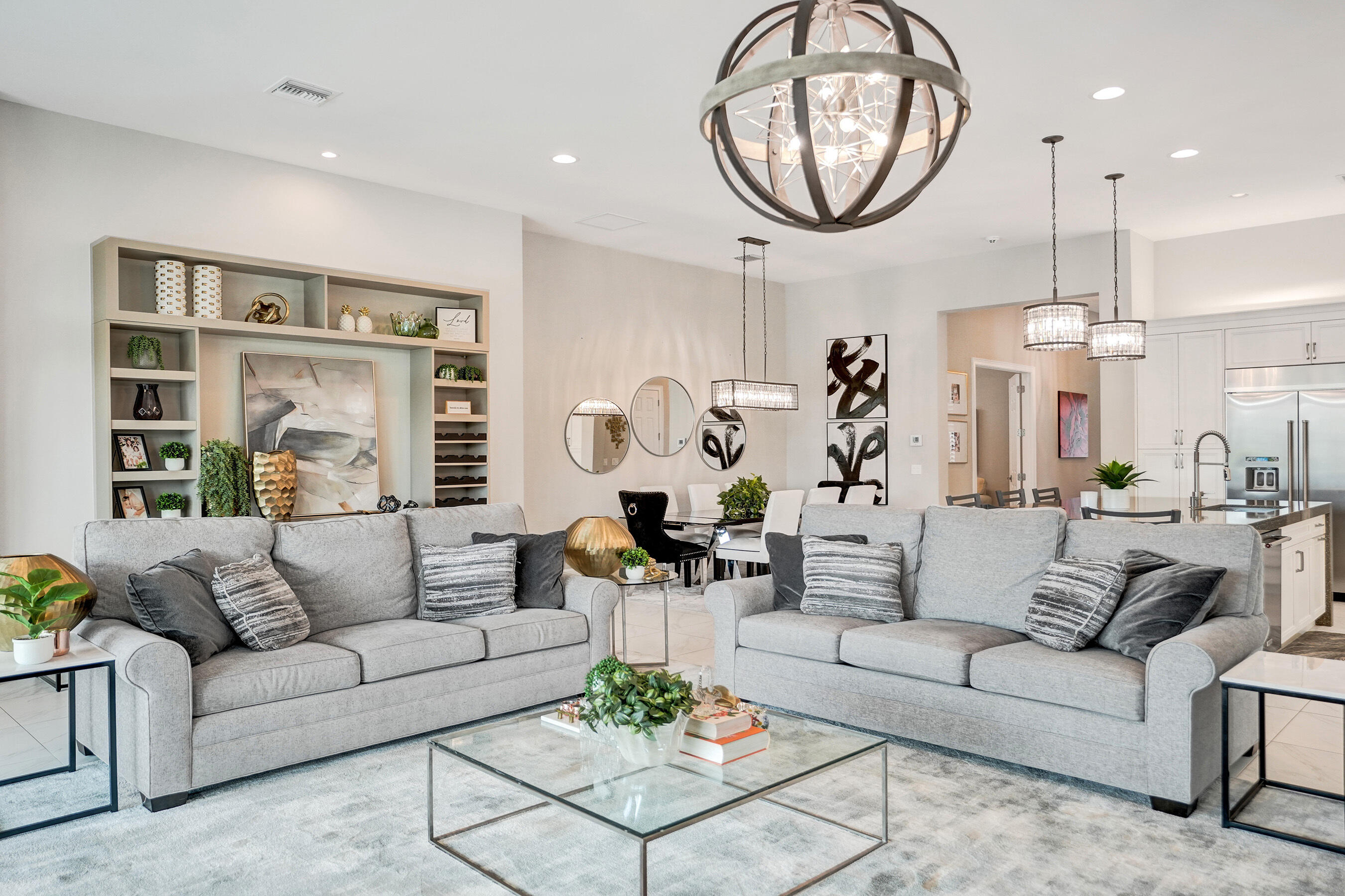 9052 Chauvet Way Boca Raton, FL 33496 - Photo 12 of 59 a living room with furniture a clock and a chandelier