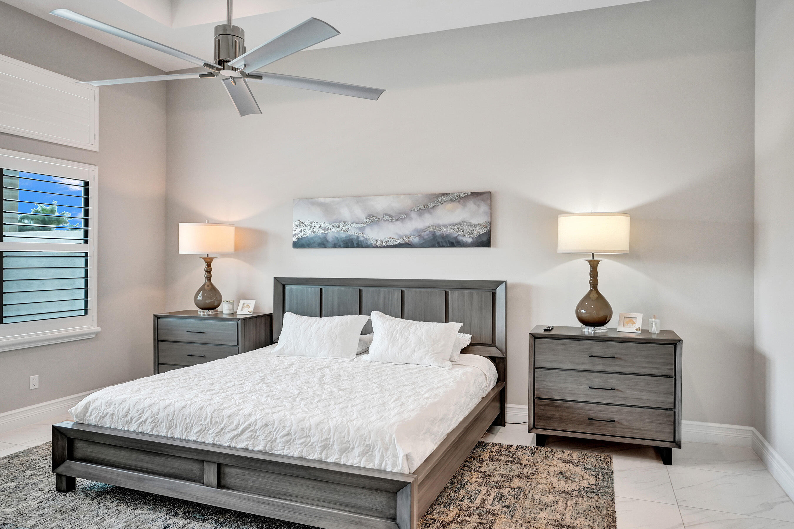 9052 Chauvet Way Boca Raton, FL 33496 - Photo 18 of 59 a bedroom with a bed and a dresser