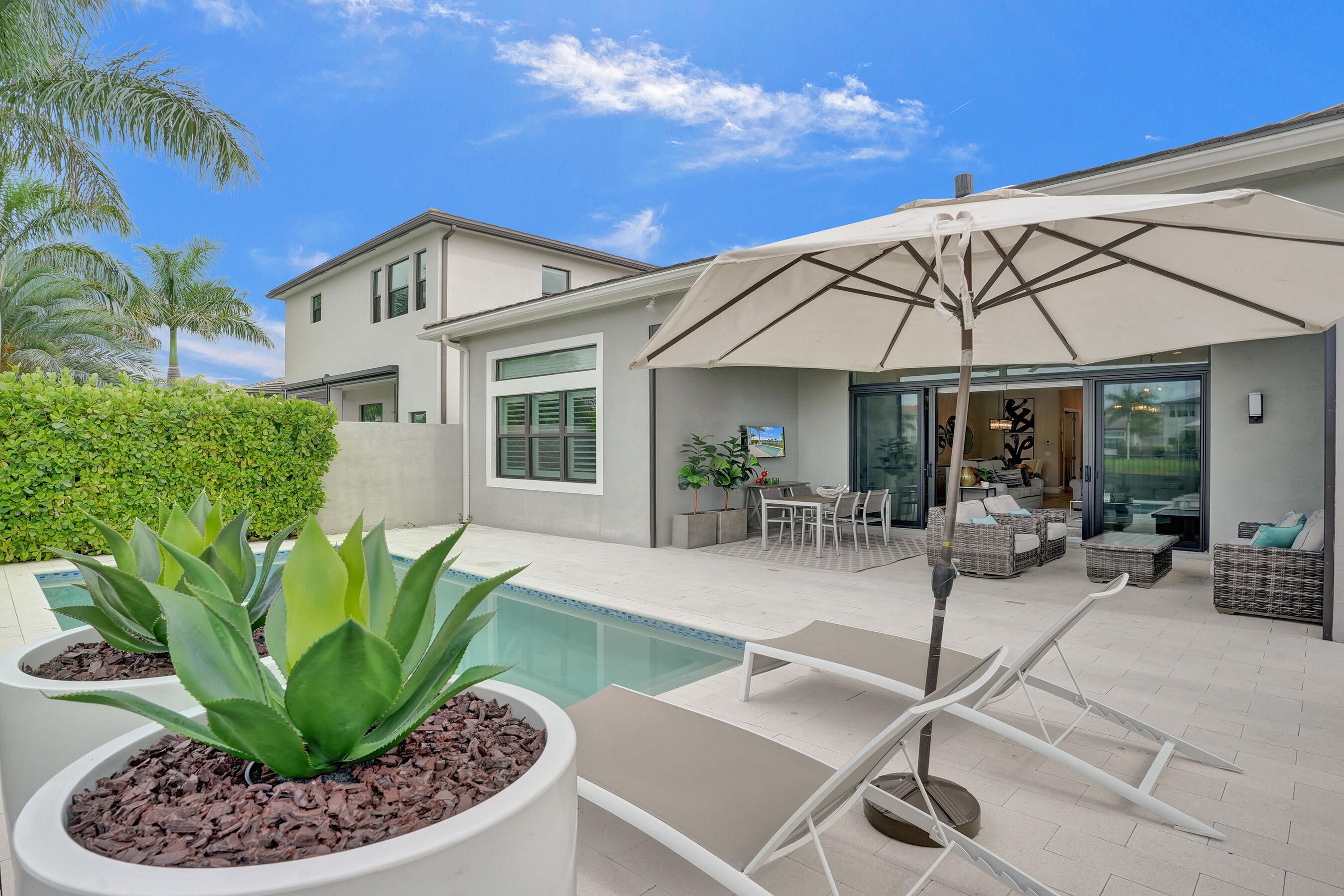 9052 Chauvet Way Boca Raton, FL 33496 - Photo 2 of 59 a view of a backyard with plants and patio