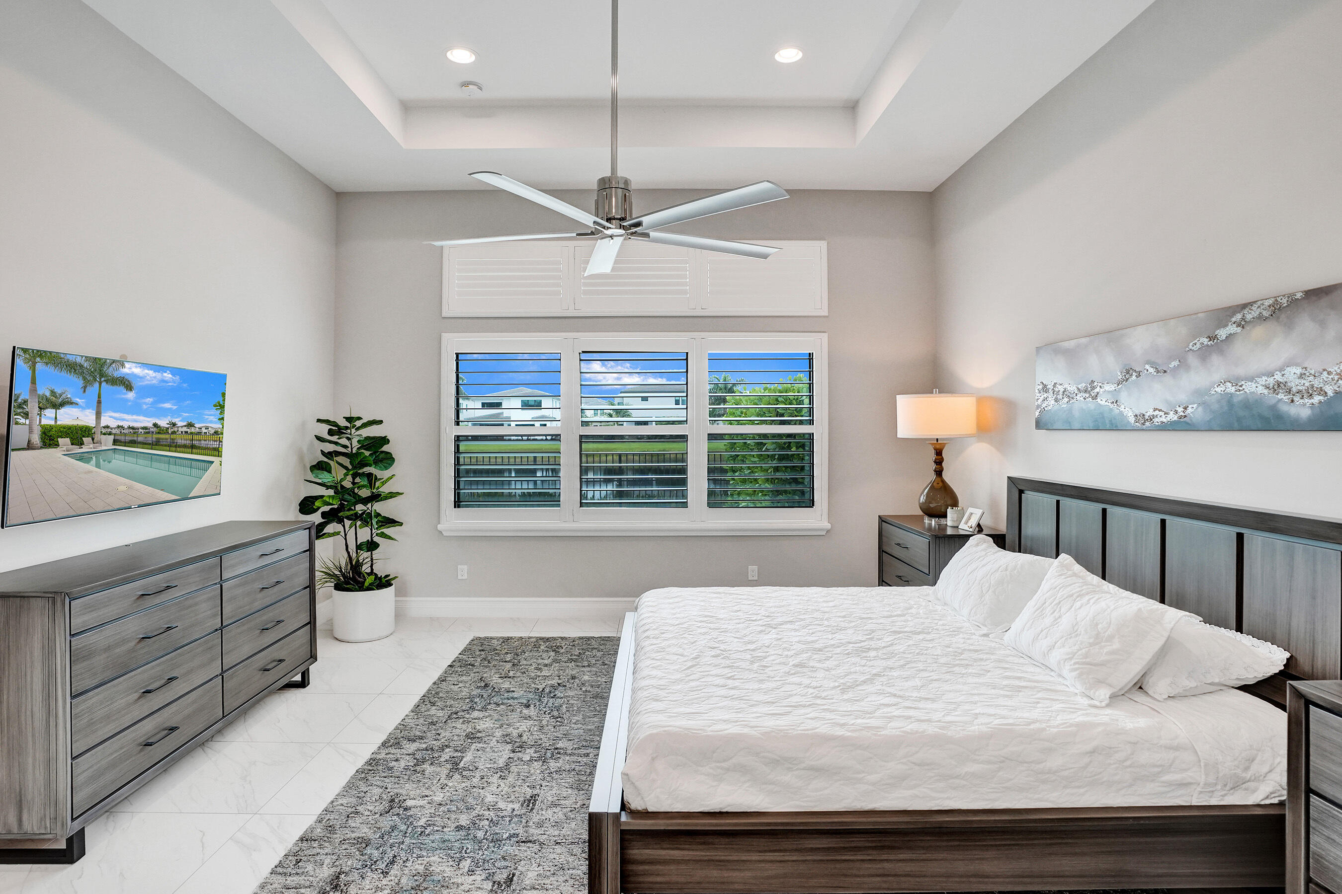 9052 Chauvet Way Boca Raton, FL 33496 - Photo 23 of 59 a bed sitting in a spacious bedroom next to a window