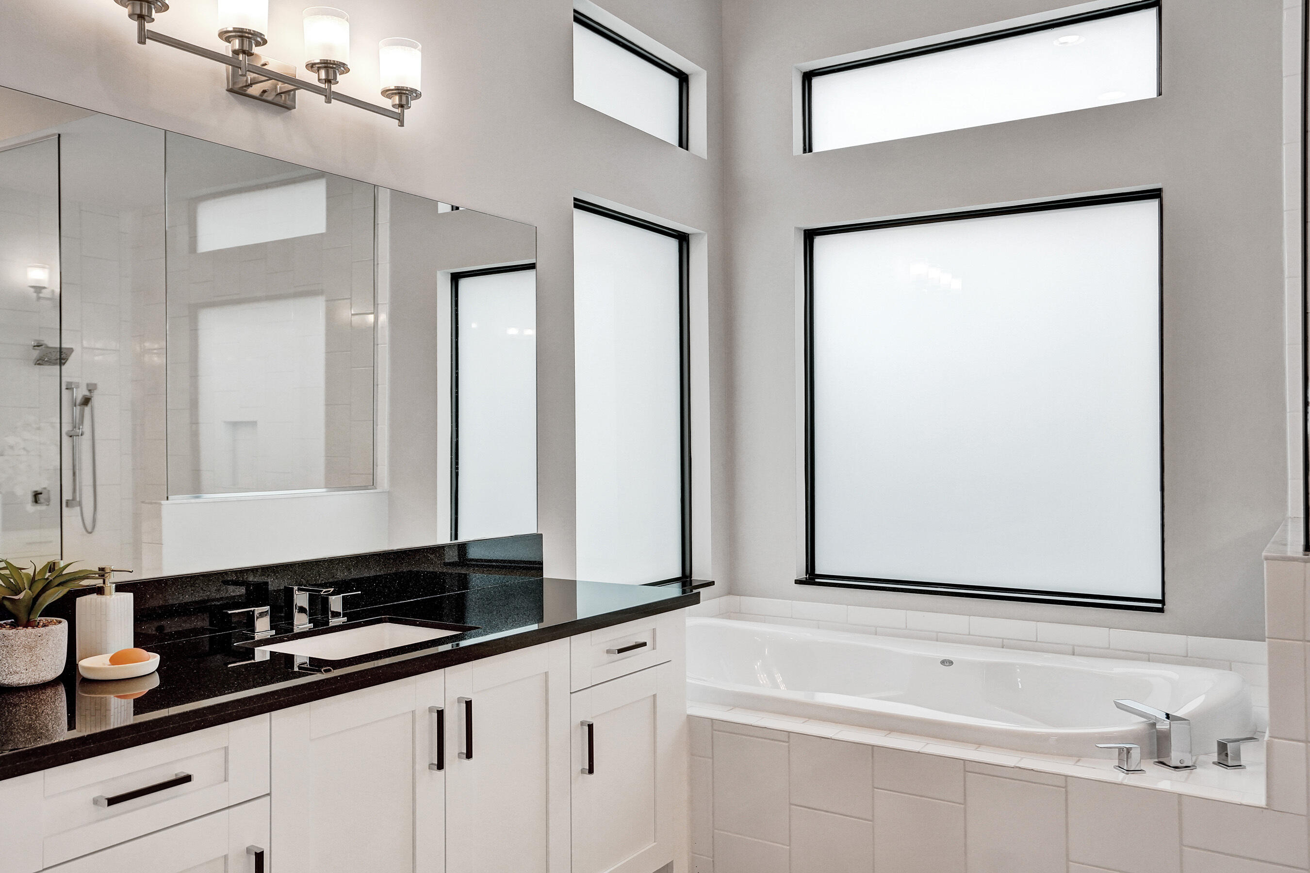 9052 Chauvet Way Boca Raton, FL 33496 - Photo 26 of 59 a bathroom with a double vanity sink and a mirror