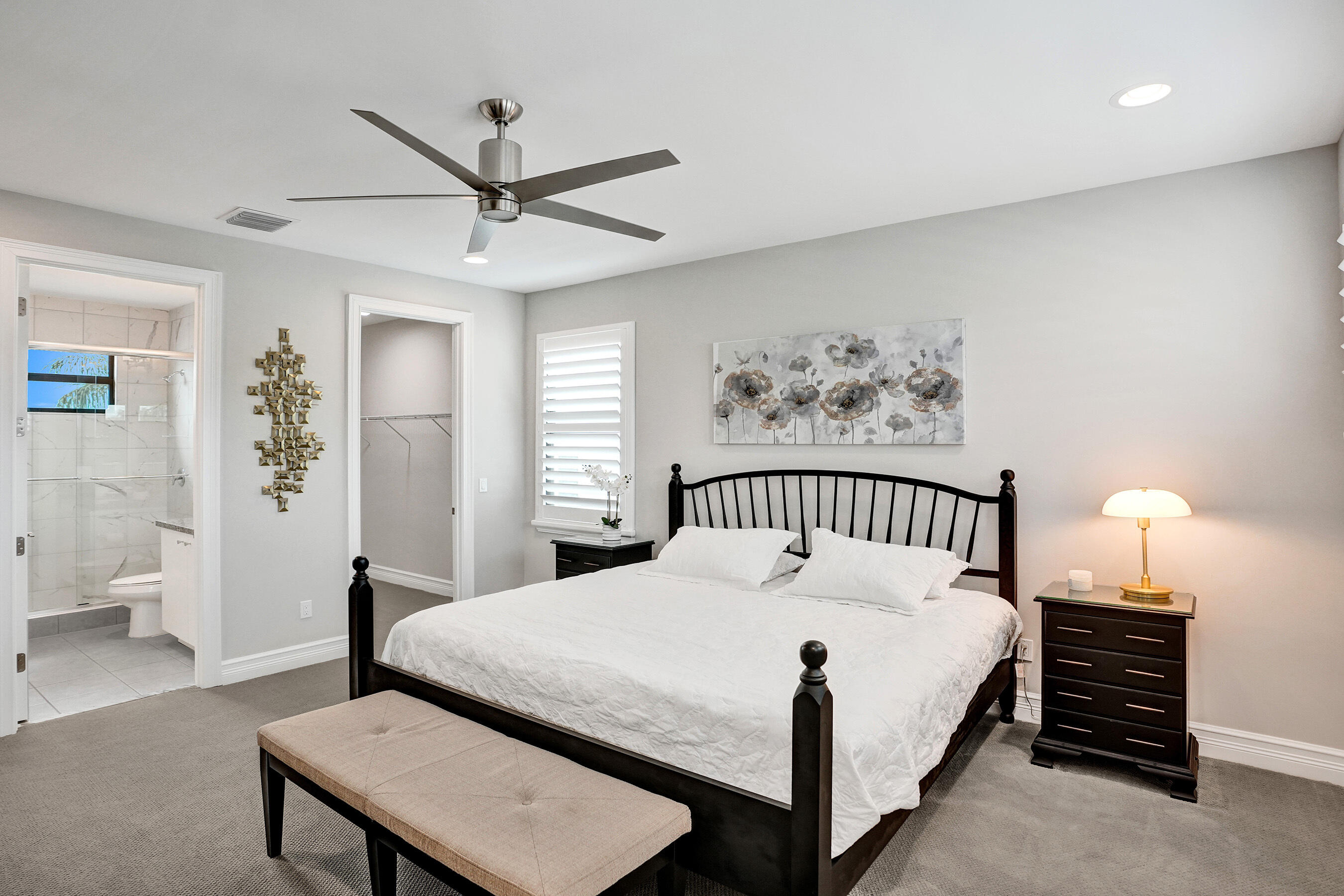 9052 Chauvet Way Boca Raton, FL 33496 - Photo 35 of 59 a bedroom with a bed and a table with closet