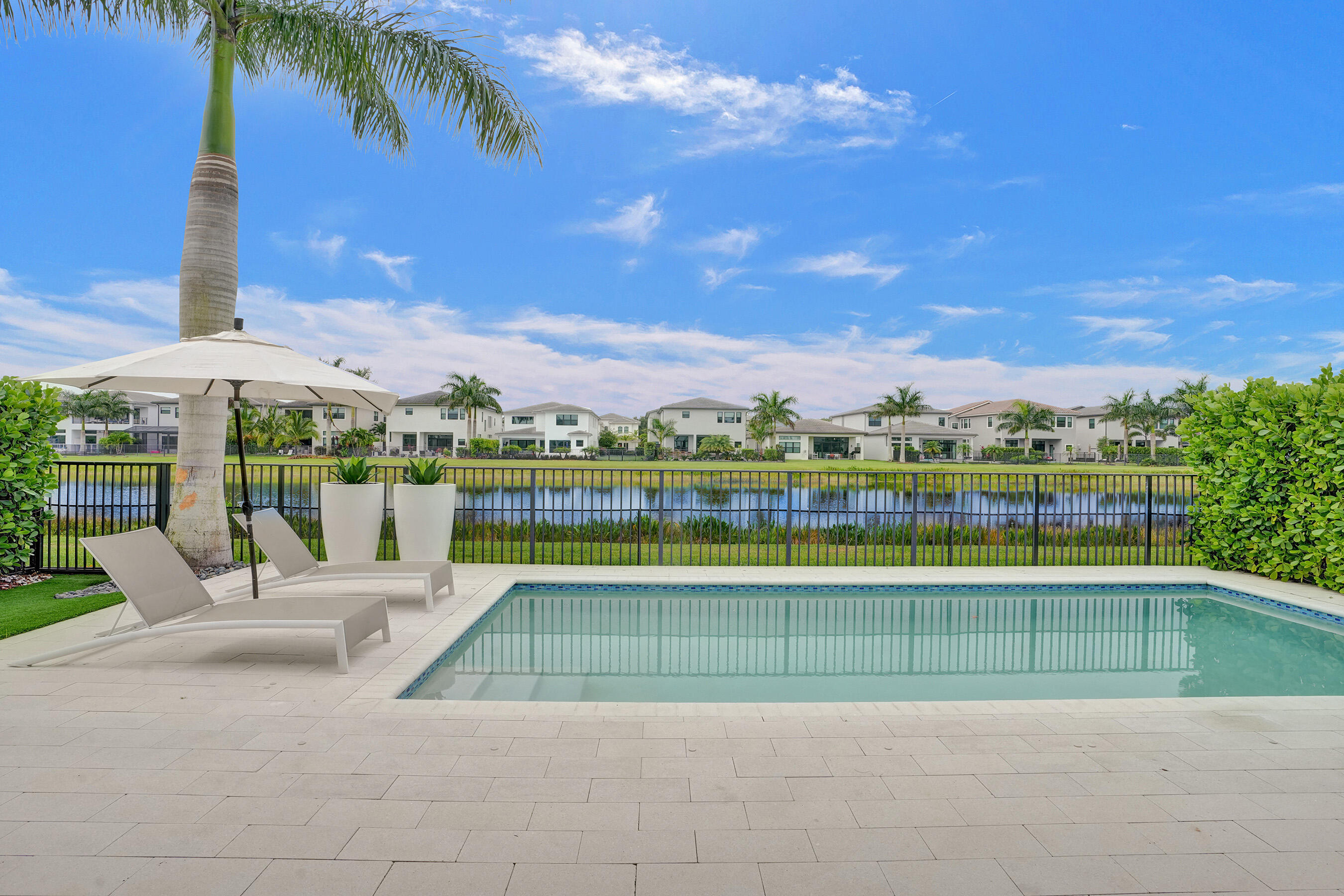 9052 Chauvet Way Boca Raton, FL 33496 - Photo 40 of 59 a view of a swimming pool and a chairs
