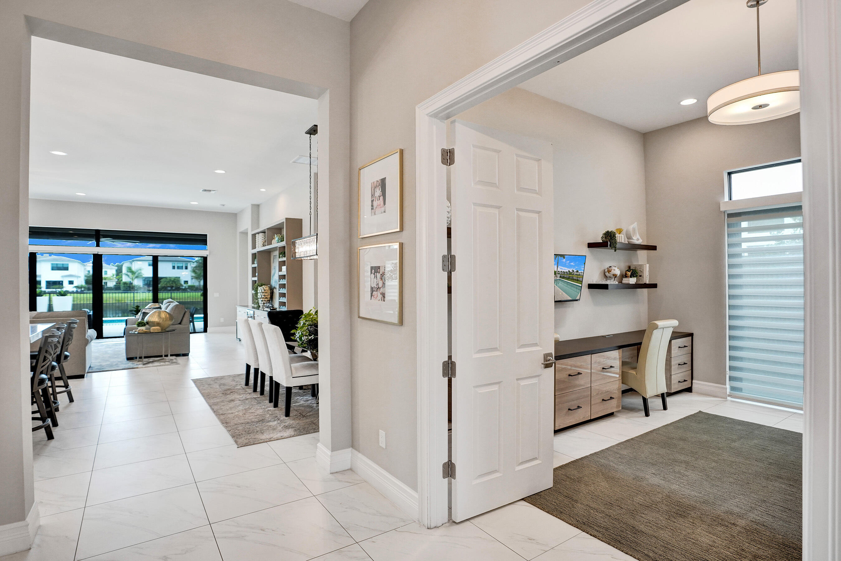 9052 Chauvet Way Boca Raton, FL 33496 - Photo 4 of 59 a very nice looking open kitchen with stainless steel appliances granite countertop a refrigerator and a stove top oven