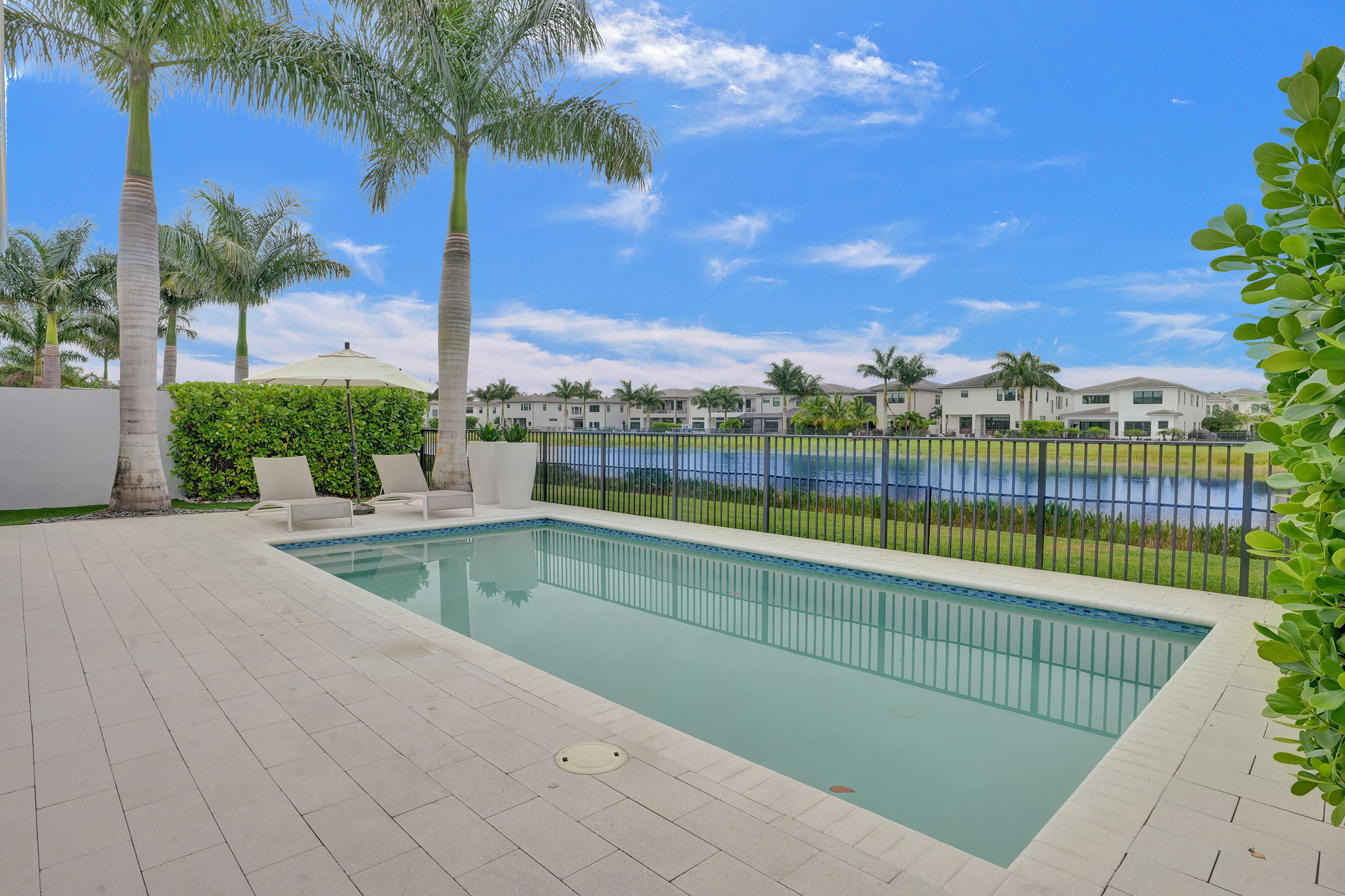 9052 Chauvet Way Boca Raton, FL 33496 - Photo 42 of 59 a view of swimming pool with outdoor seating and plants