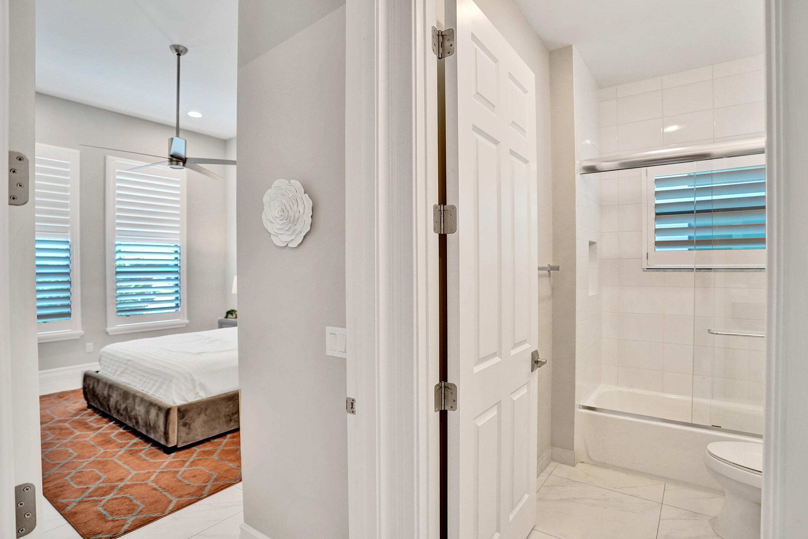 9052 Chauvet Way Boca Raton, FL 33496 - Photo 43 of 59 a spacious bedroom with a bed and a window