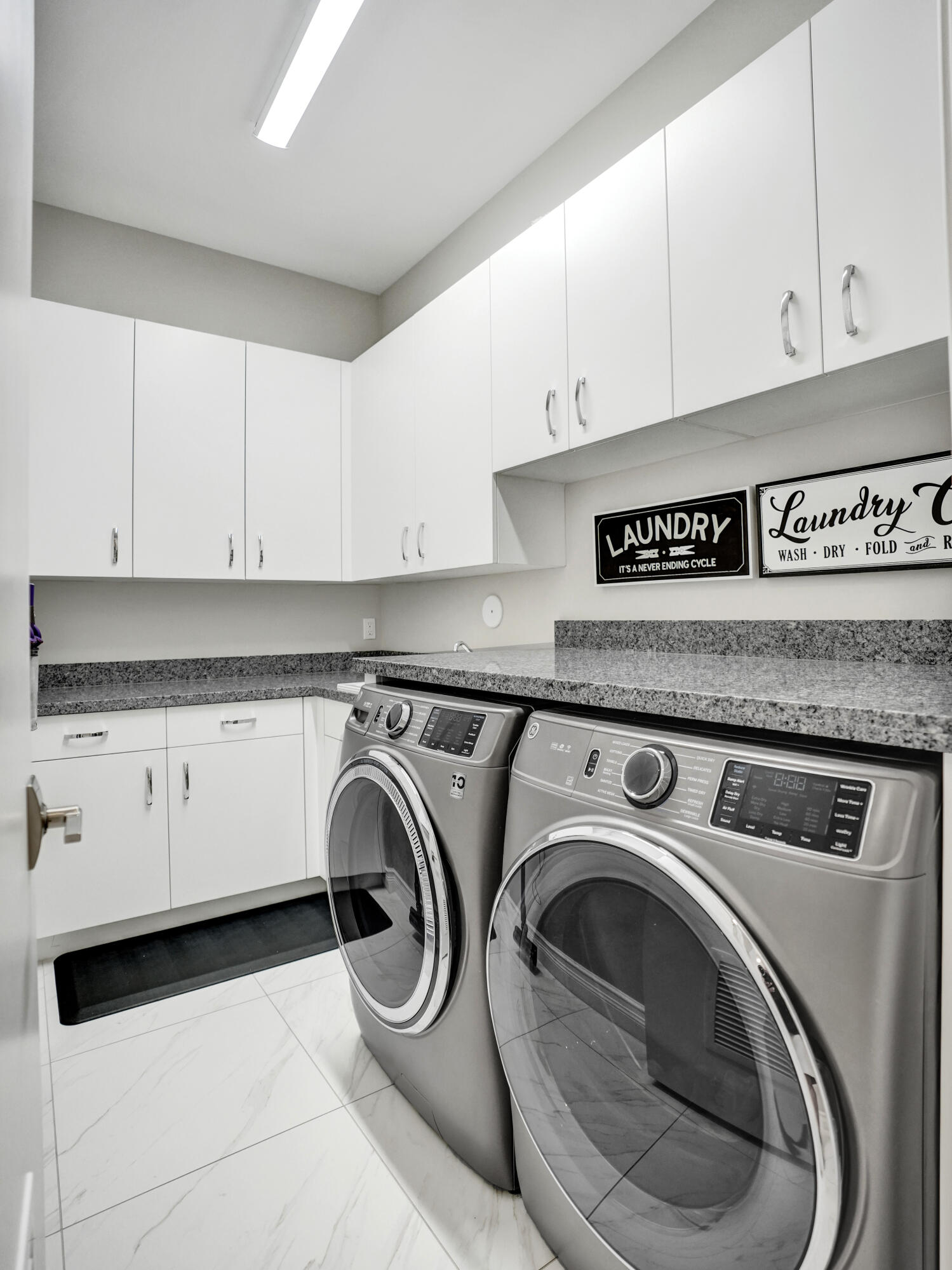 9052 Chauvet Way Boca Raton, FL 33496 - Photo 46 of 59 a utility room with dryer and washer