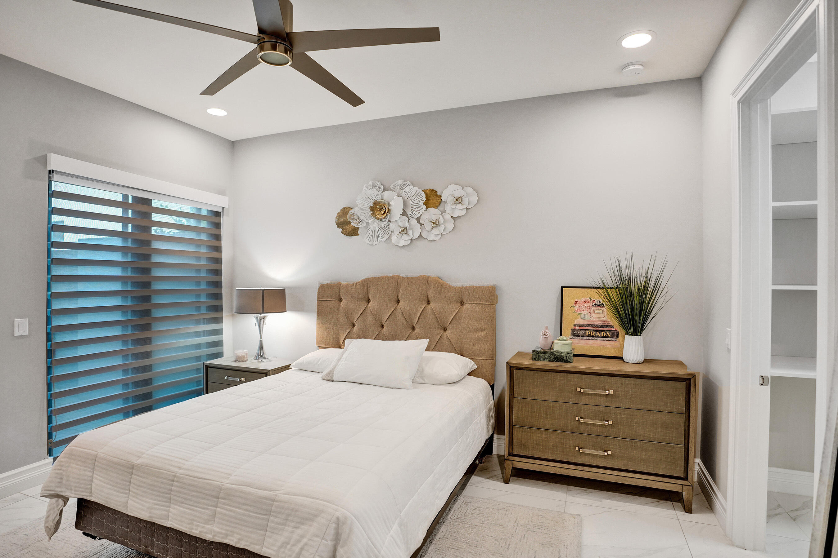 9052 Chauvet Way Boca Raton, FL 33496 - Photo 49 of 59 a bedroom with a bed and a window