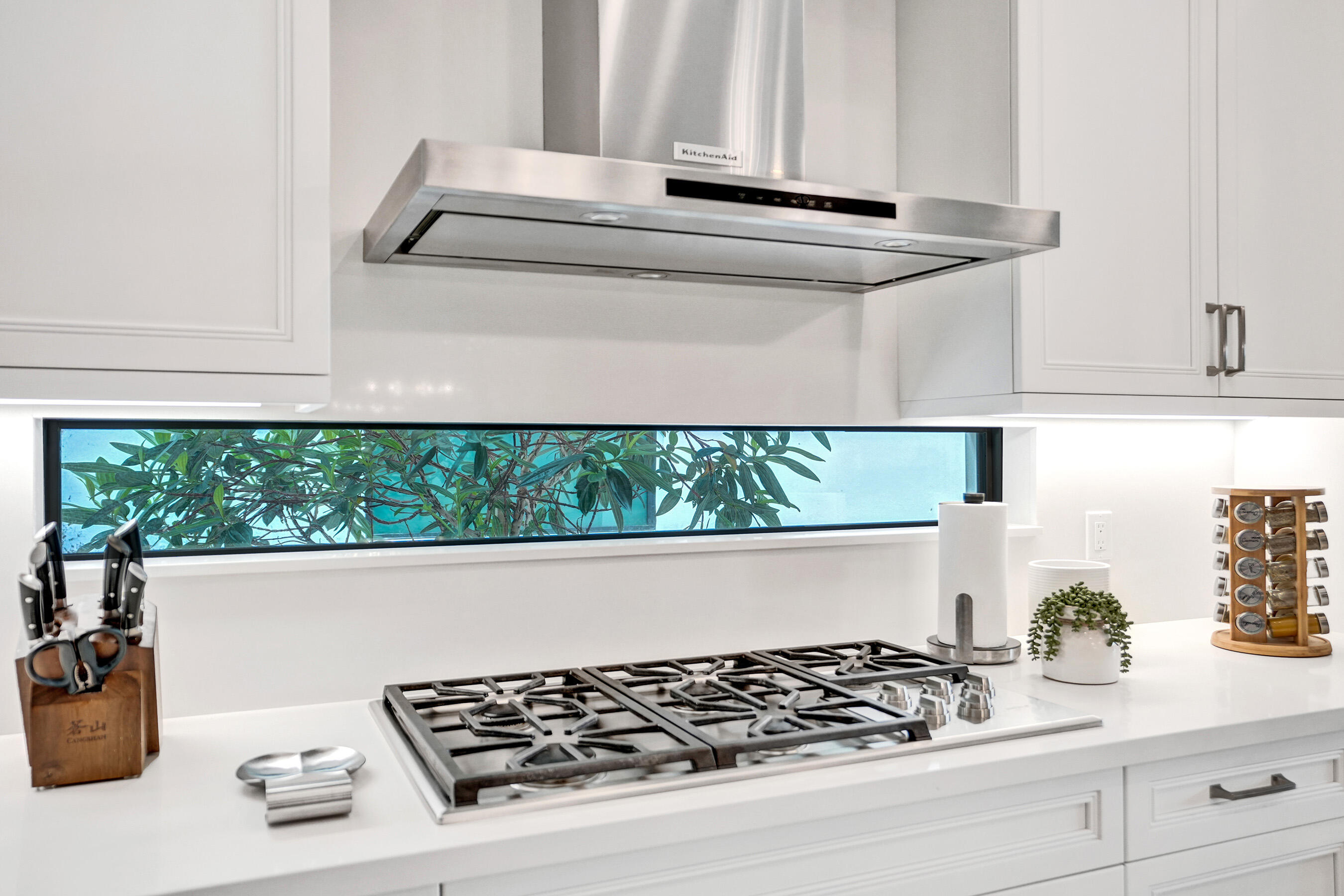 9052 Chauvet Way Boca Raton, FL 33496 - Photo 9 of 59 a kitchen with a stove and a white wooden cabinets