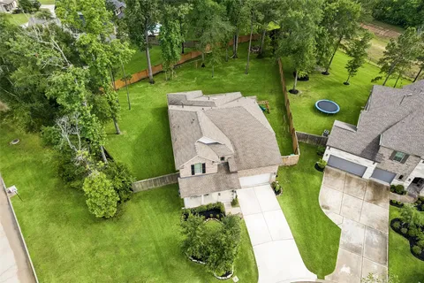 an aerial view of a house with pool