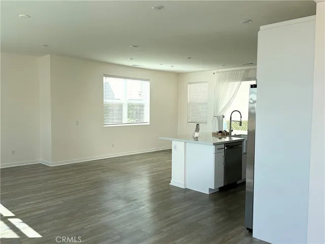 a view of kitchen and wooden floor