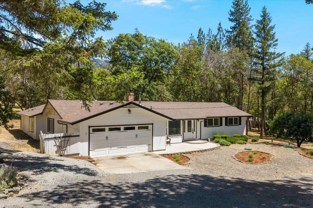 324 China Gulch Road Jacksonville, OR 97530 - Photo 2 of 45 a front view of a house with a yard