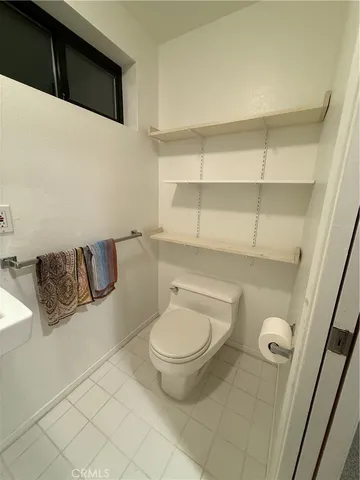 a view of empty room with window and fireplace