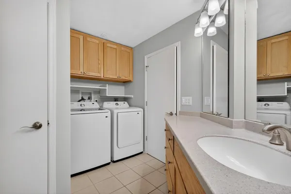 a bathroom with a sink a vanity and a mirror
