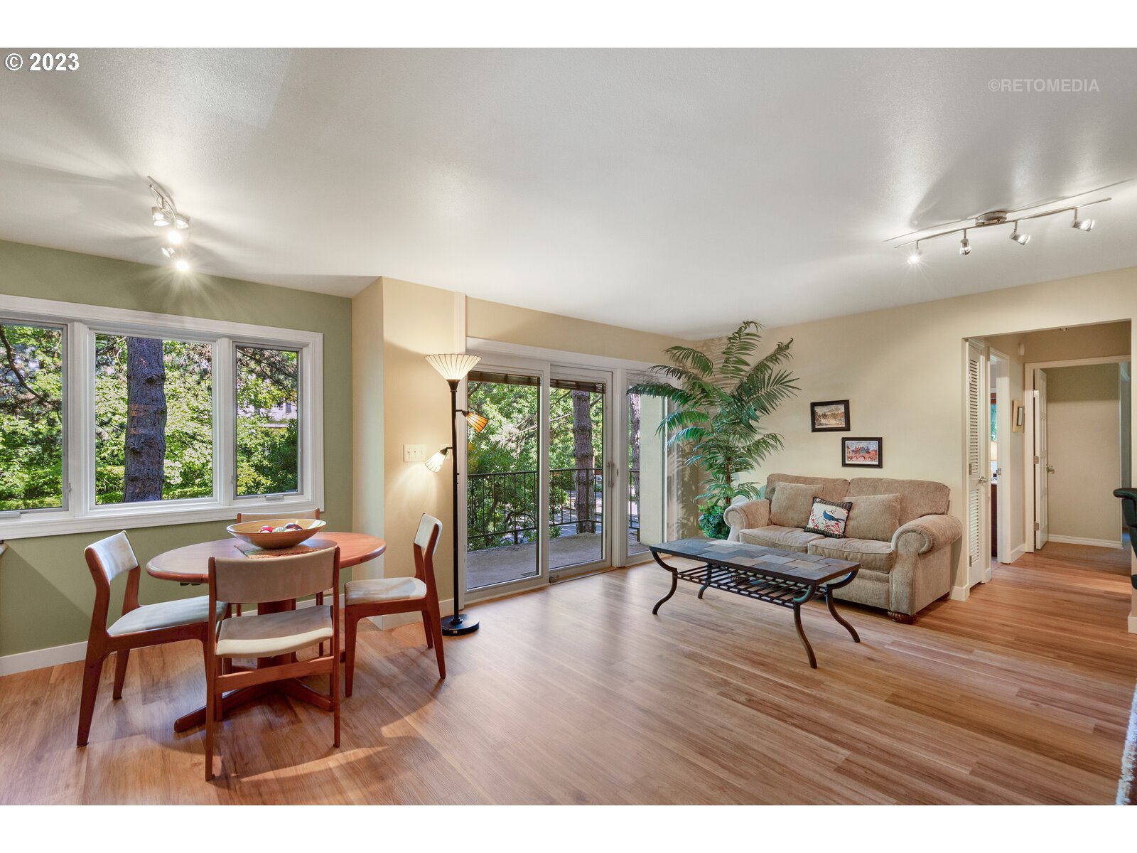 2021 Southwest Main Street, Unit 32 Portland, OR 97205 - Photo 13 of 38 a living room with furniture and a wooden floor