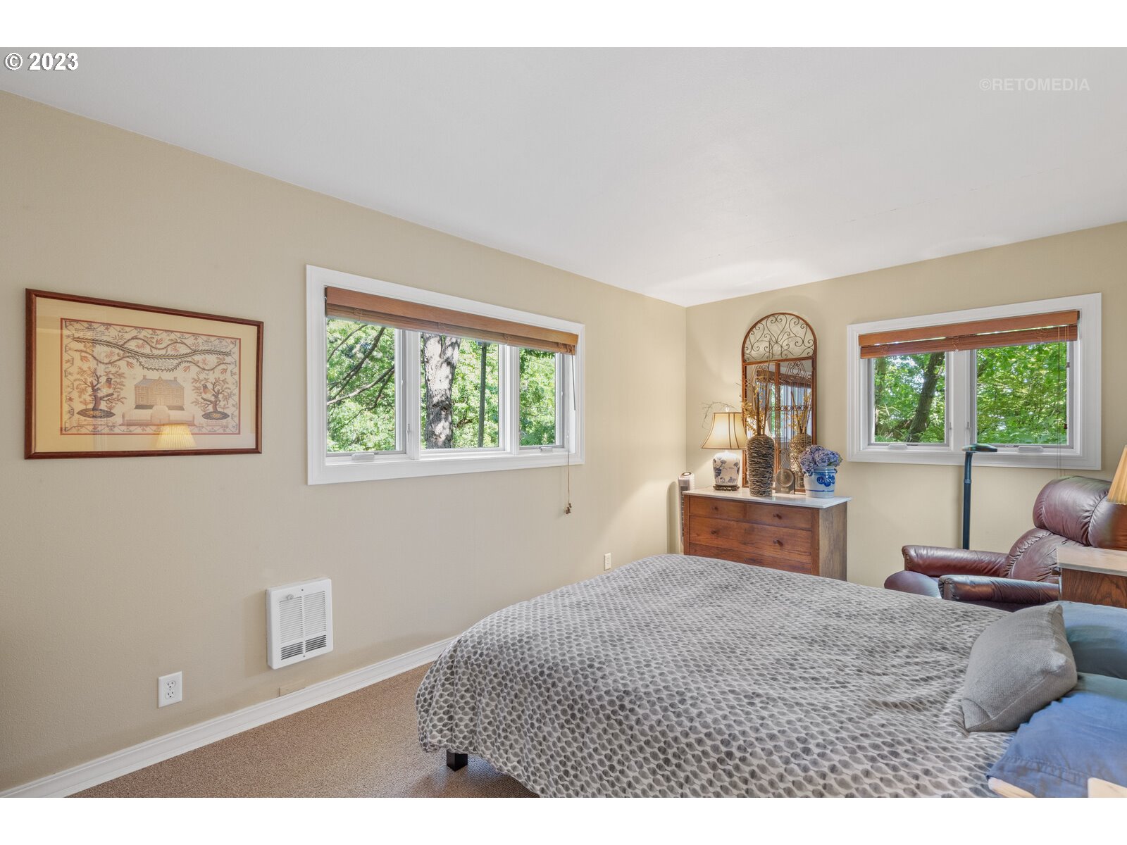 2021 Southwest Main Street, Unit 32 Portland, OR 97205 - Photo 15 of 38 a bedroom with furniture and a window