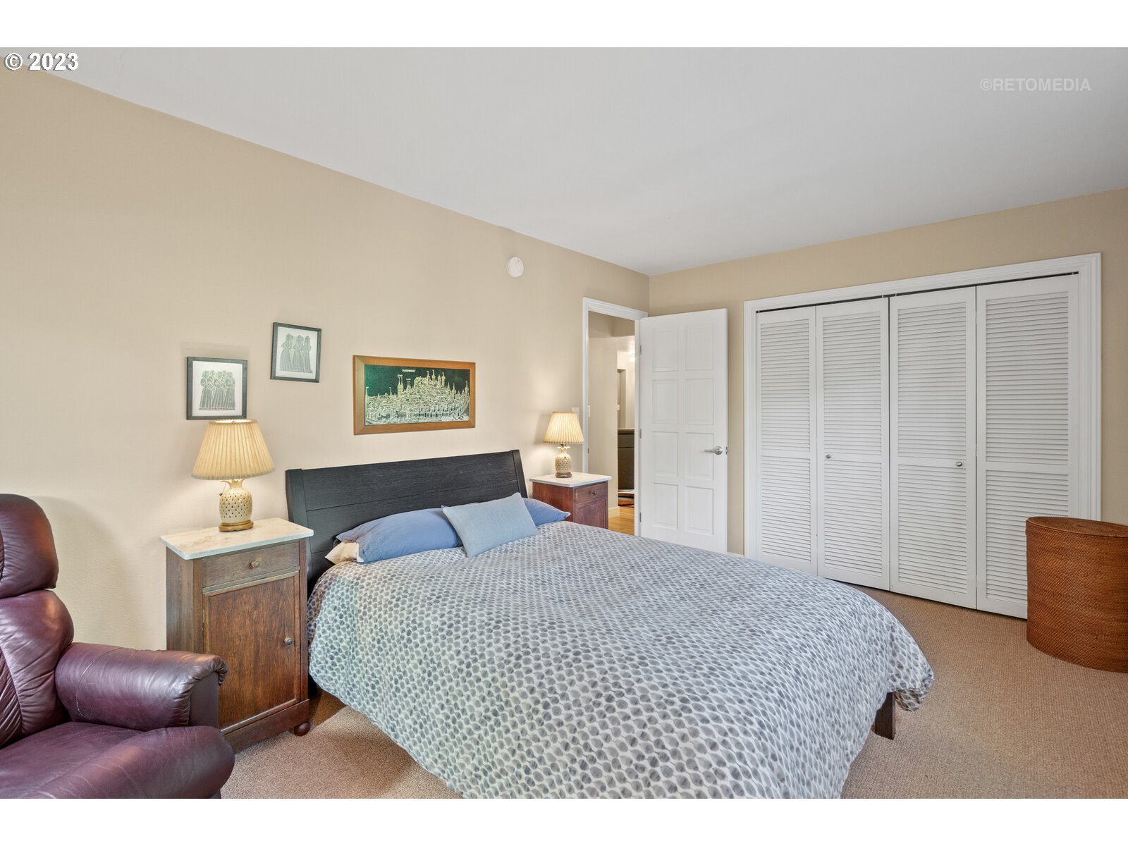 2021 Southwest Main Street, Unit 32 Portland, OR 97205 - Photo 17 of 38 a bedroom with a bed and a couch