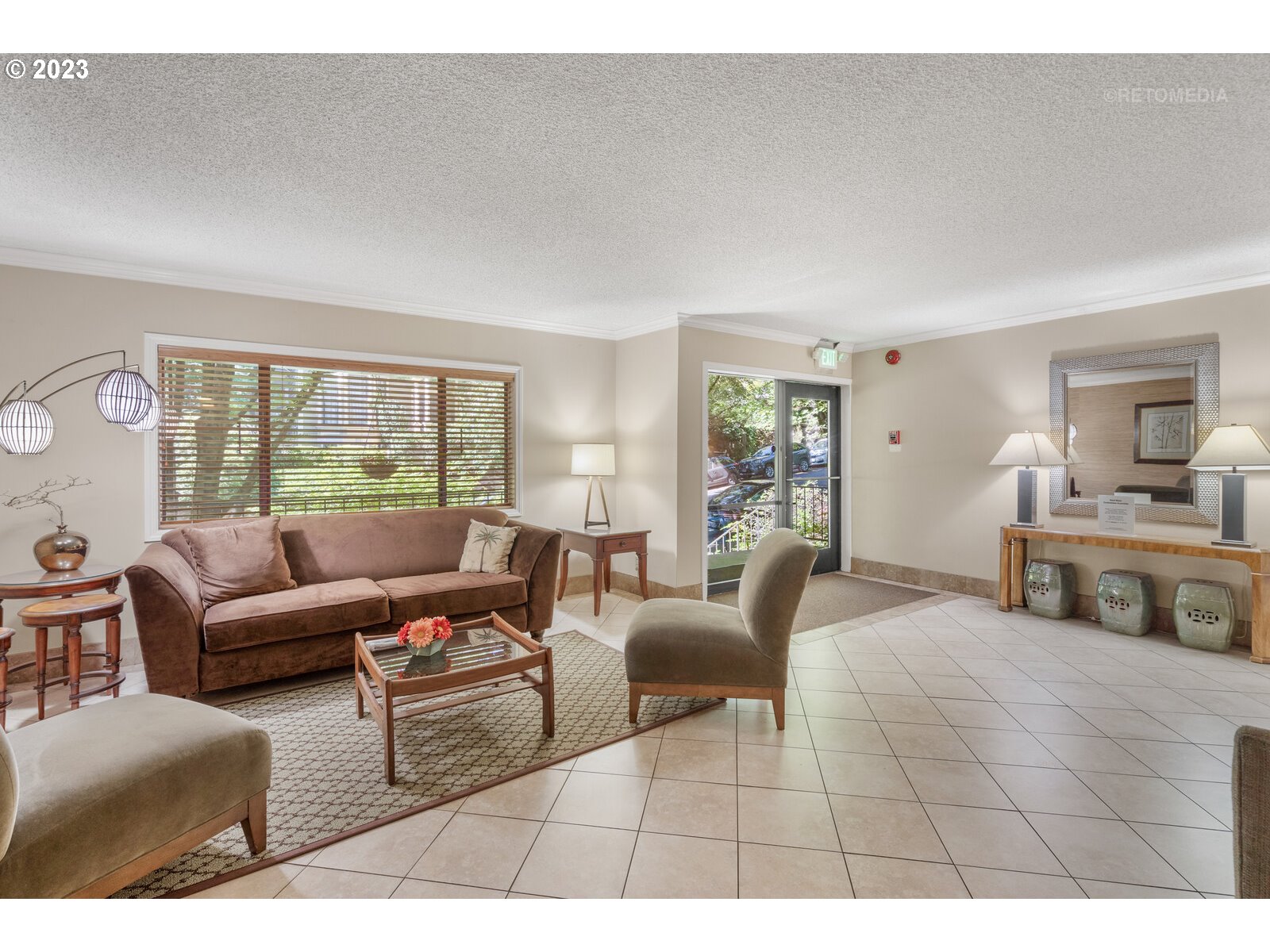 2021 Southwest Main Street, Unit 32 Portland, OR 97205 - Photo 2 of 38 a living room with furniture and a large window