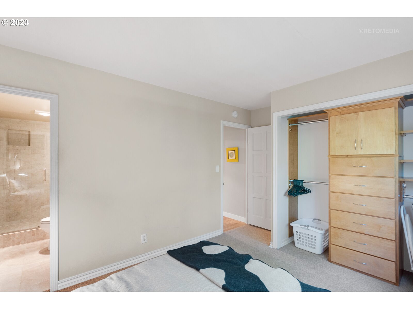 2021 Southwest Main Street, Unit 32 Portland, OR 97205 - Photo 21 of 38 a view of an empty room and closet with wooden floor
