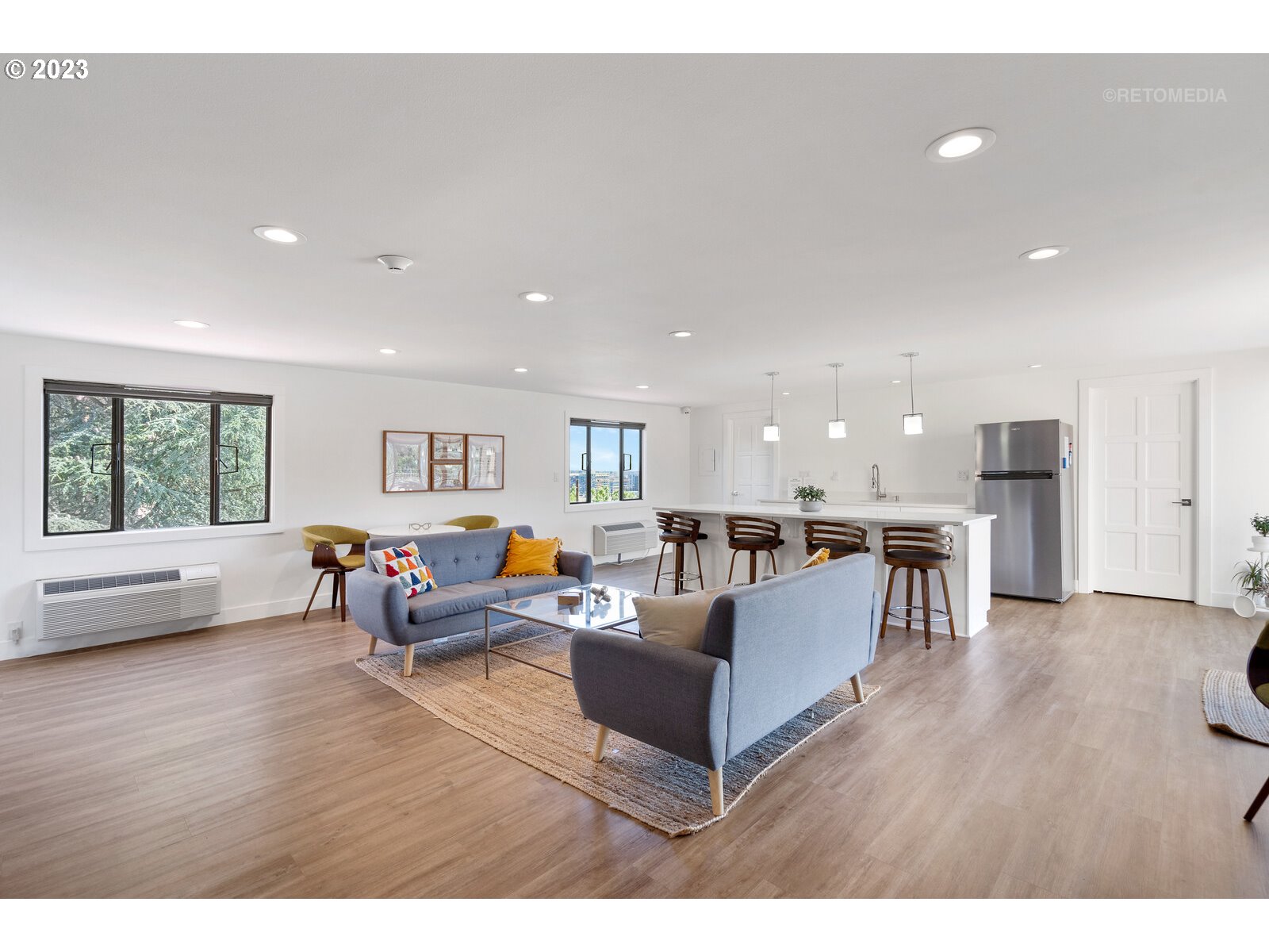 2021 Southwest Main Street, Unit 32 Portland, OR 97205 - Photo 26 of 38 a living room with furniture and a table