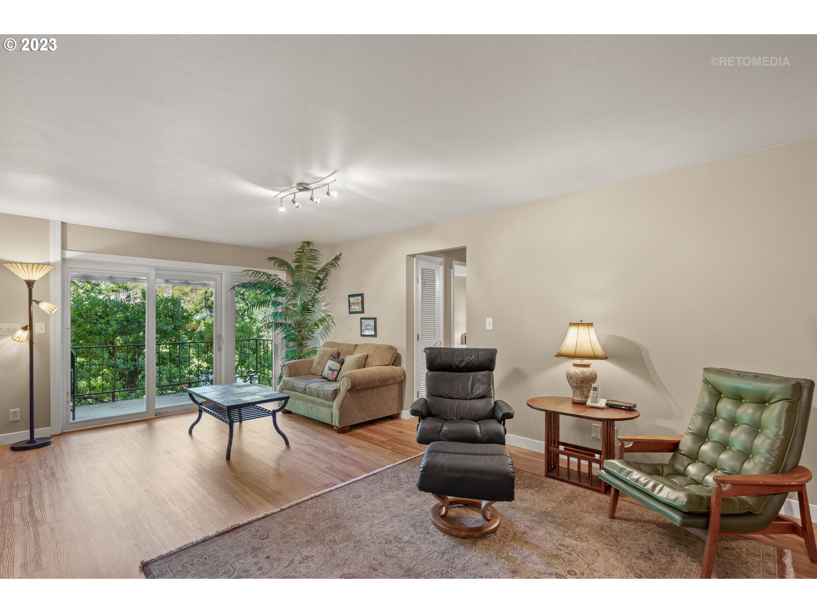 2021 Southwest Main Street, Unit 32 Portland, OR 97205 - Photo 3 of 38 a living room with furniture and a large window
