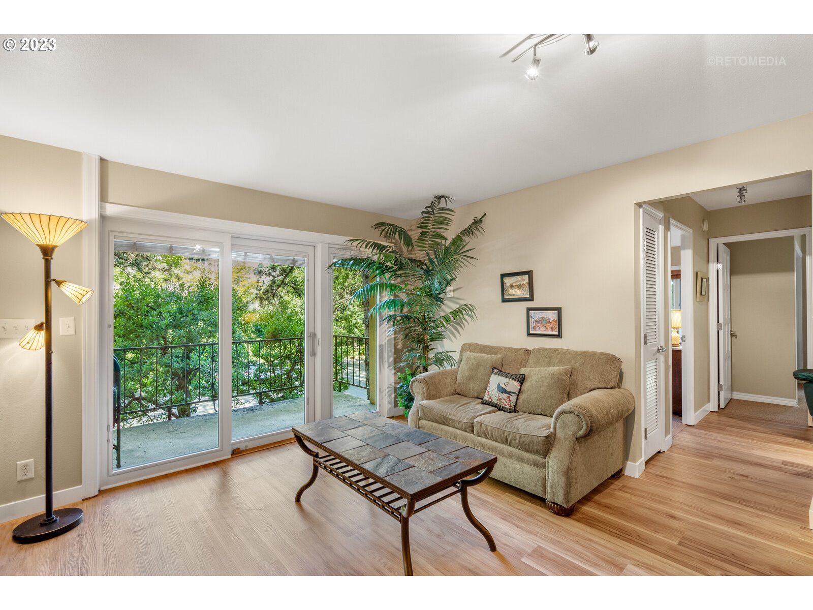 2021 Southwest Main Street, Unit 32 Portland, OR 97205 - Photo 7 of 38 a living room with furniture a table and a large window