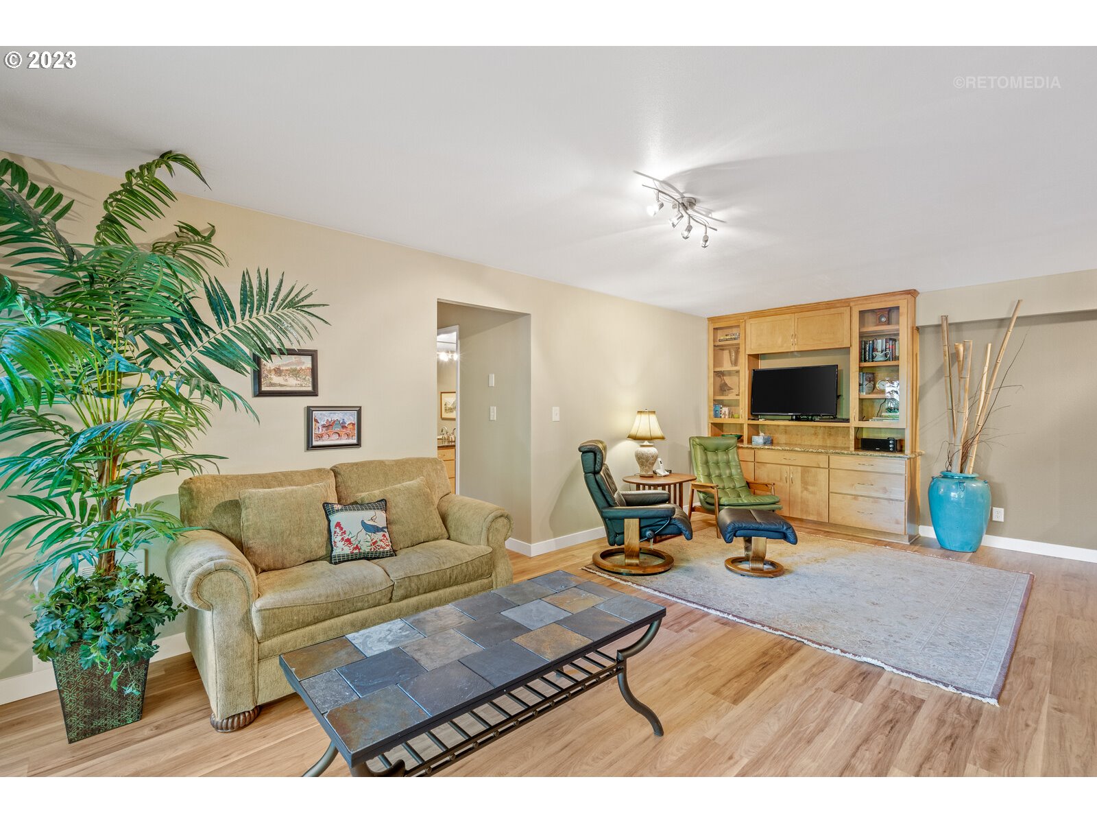 2021 Southwest Main Street, Unit 32 Portland, OR 97205 - Photo 8 of 38 a living room with furniture and a flat screen tv