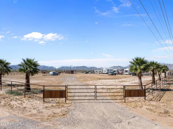 a view of outdoor space with palm trees