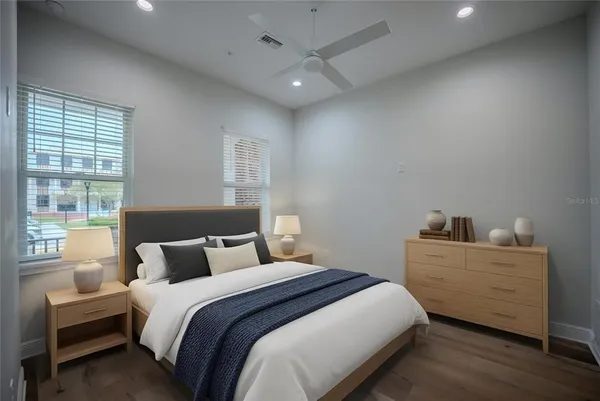 a bedroom with bed and window