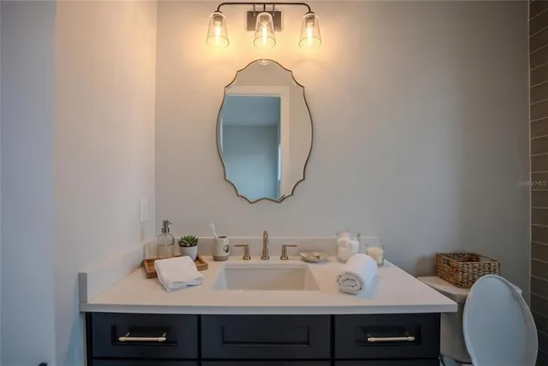 a bathroom with a sink and a mirror