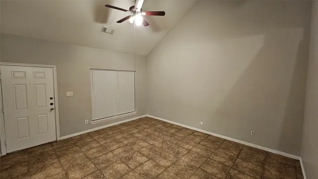 an empty room with fan
