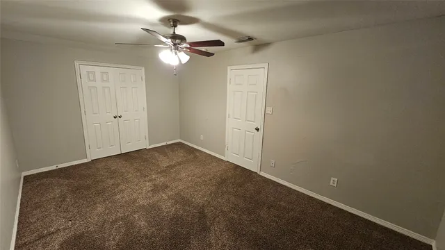 a view of a room with a fan