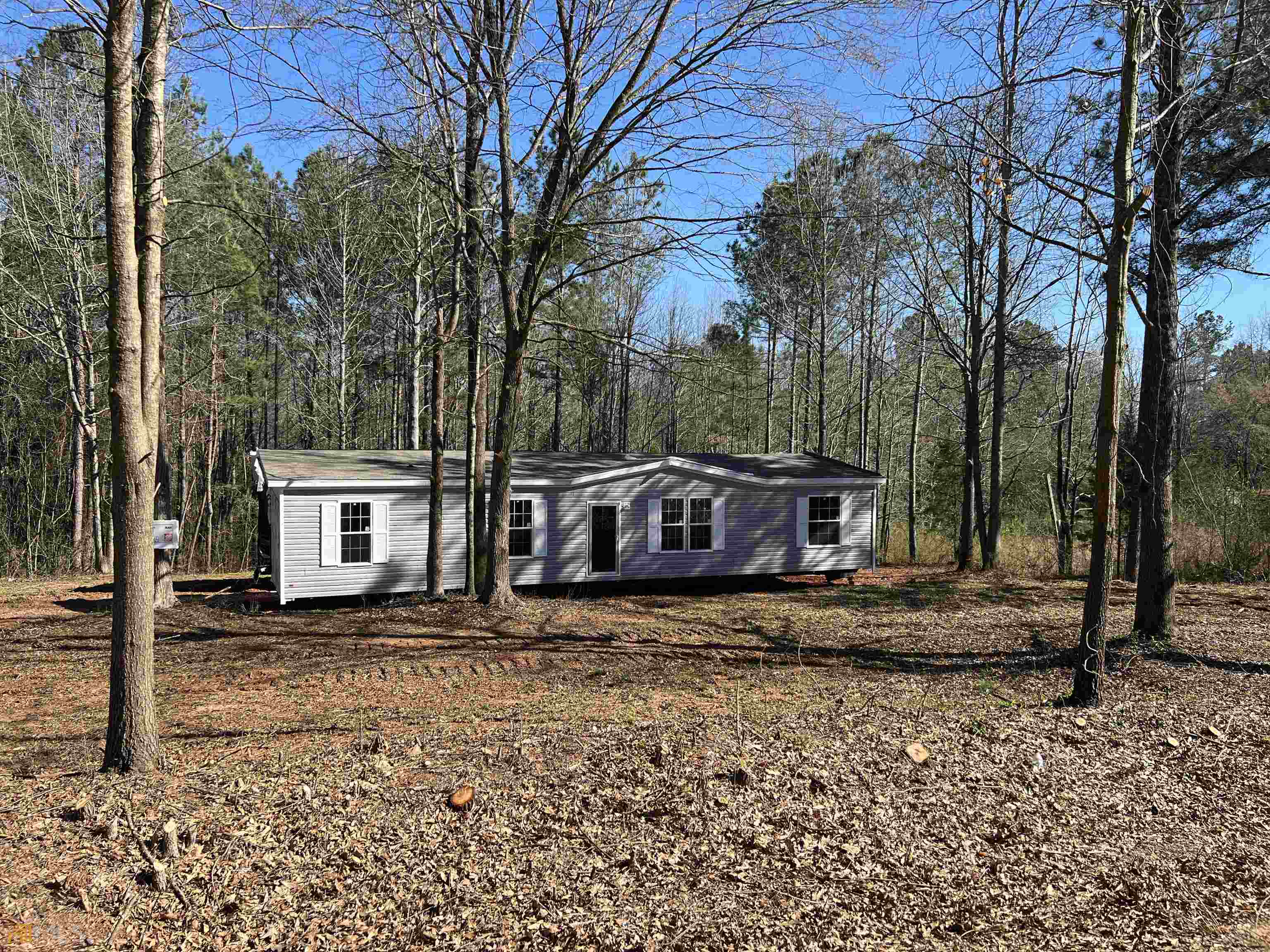 436 Jim David Road, Unit AGENT Nicholson, GA 30565 - Photo 1 of 1 a wooden house with trees in front of it