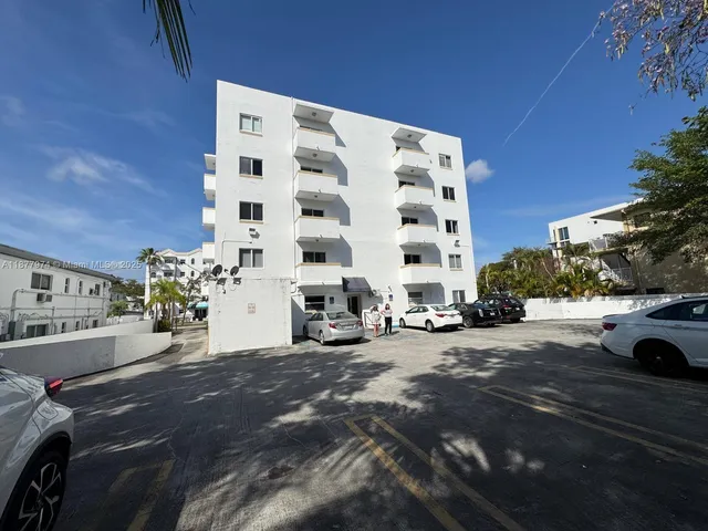 a view of a street with cars